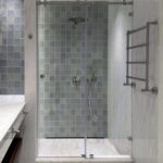 Modern bathroom with a glass shower enclosure and tiled walls